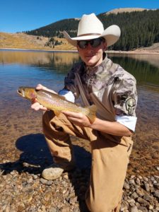 Man holding is fishing catch