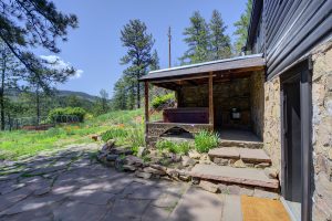 View of back yard and hot tub cubby