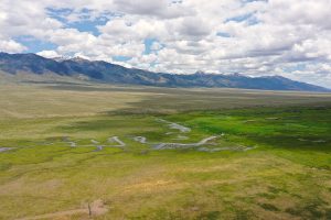 view down valley with green pastures