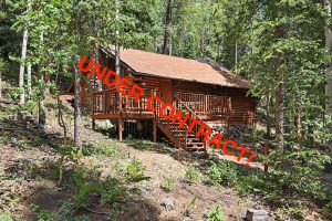 cabin front with under contract banner